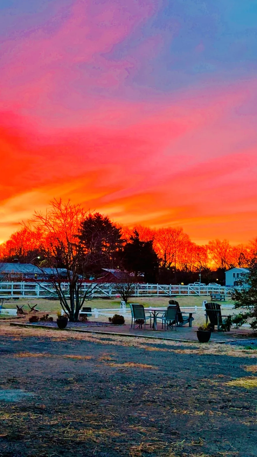 A vivid pink-and-red sunrise over Lepore Farm